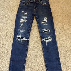 Patched distressed American eagle jeans.